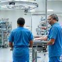 Surgical suite with operating table and veterinarian team